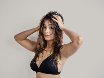 a woman in a bikini posing for a picture
