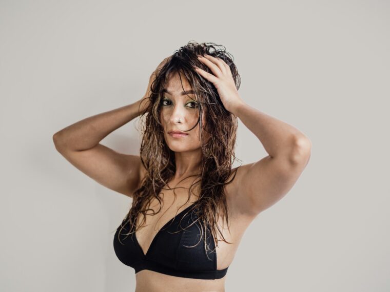 a woman in a bikini posing for a picture