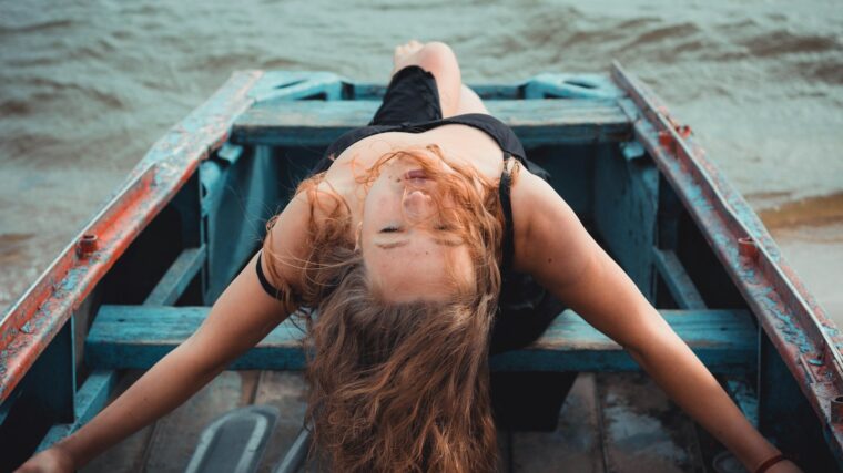 woman riding on jon boat