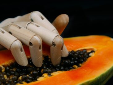 sliced fruit on orange plate
